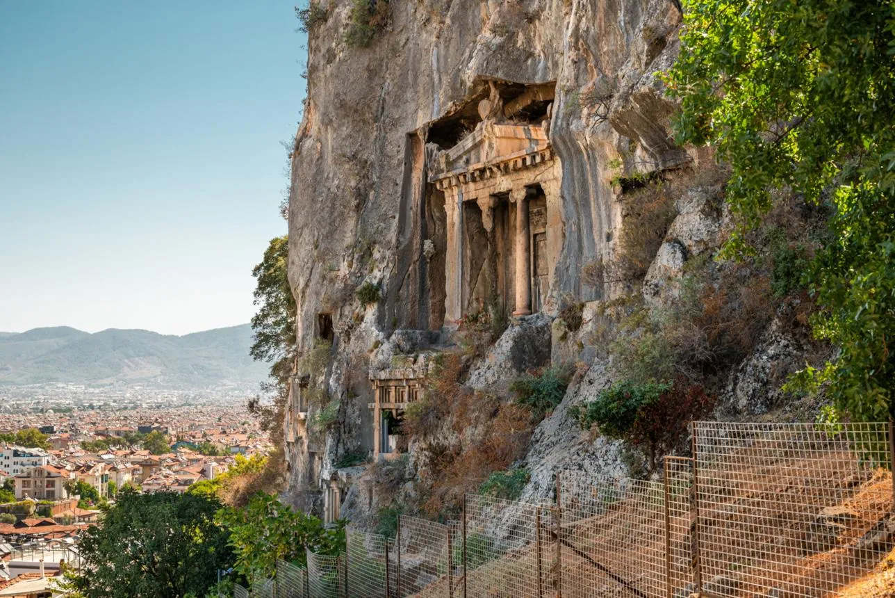 The temple-fronted Tomb of Amyntas carved into the cliff above Fethiye