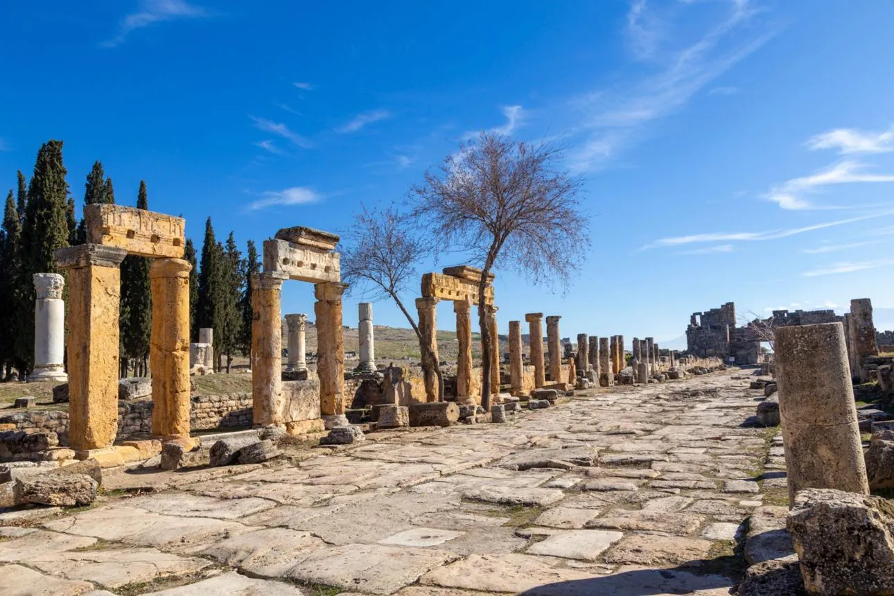 Columns and stone arches lining Frontinus Street in Hierapolis