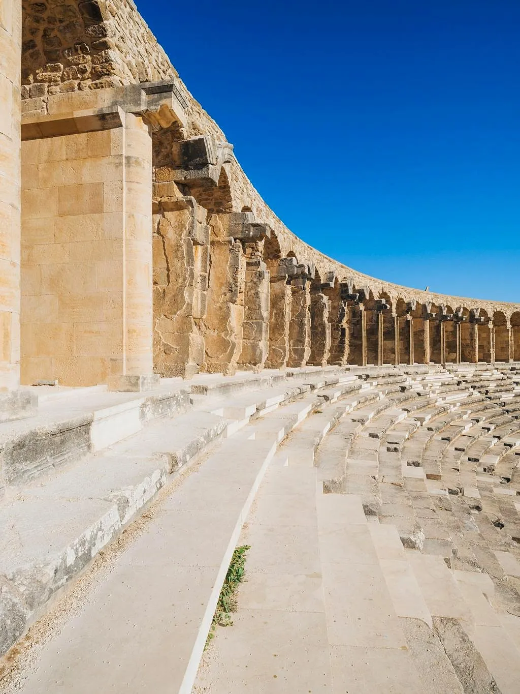 The curved stone seating of the theatre of Aspendos