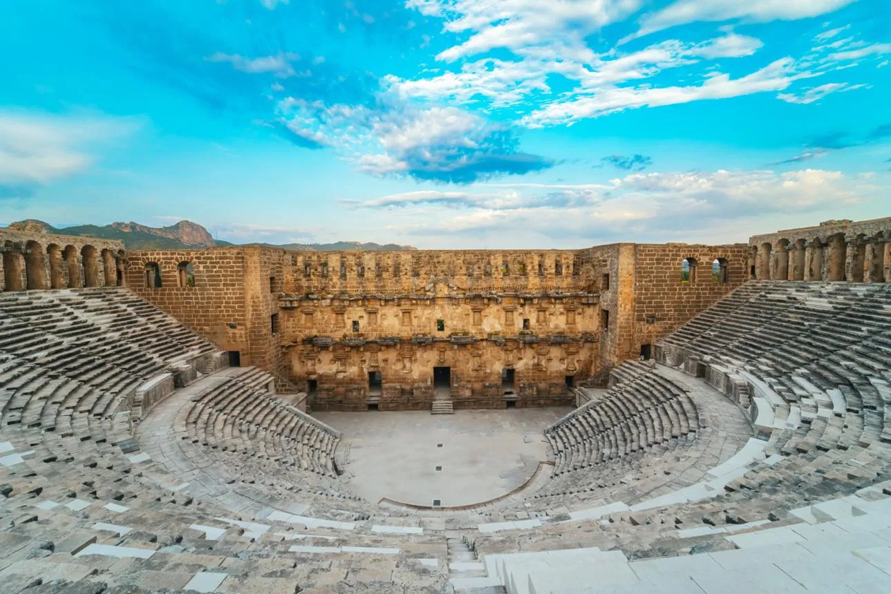 The stage building and curved seating of the Roman theatre at Aspendos
