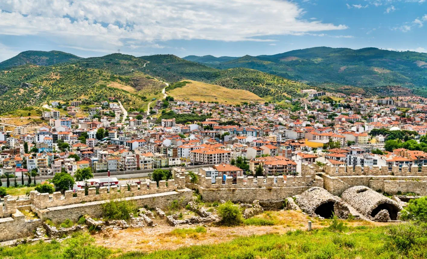 The walls of Ayasuluk Castle with the town of Selçuk below