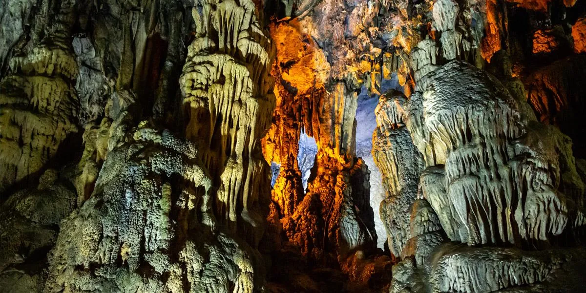 Lit stalactites and rock formations inside Bulak Mencilis Cave