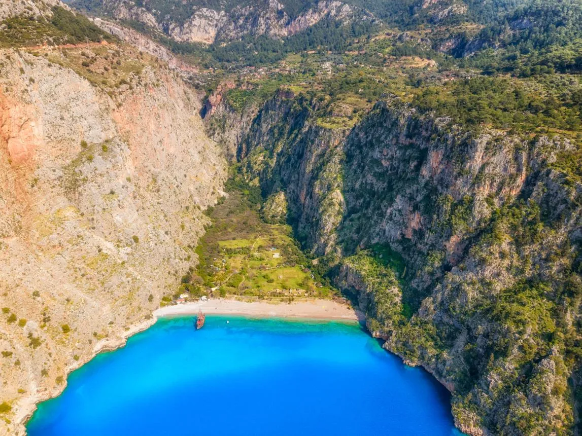Butterfly Valley's beach and turquoise bay between towering cliffs