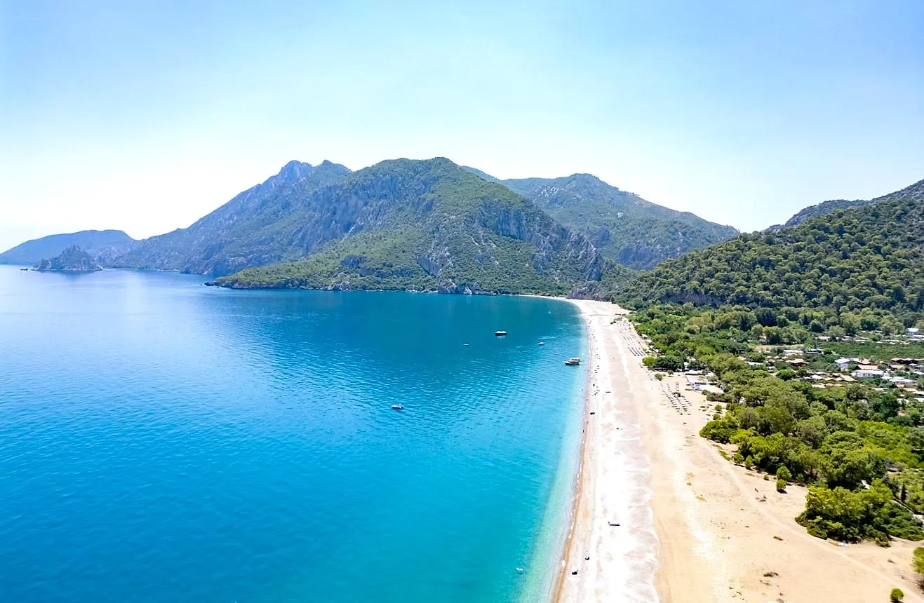 The long beach of Çıralı below wooded mountains