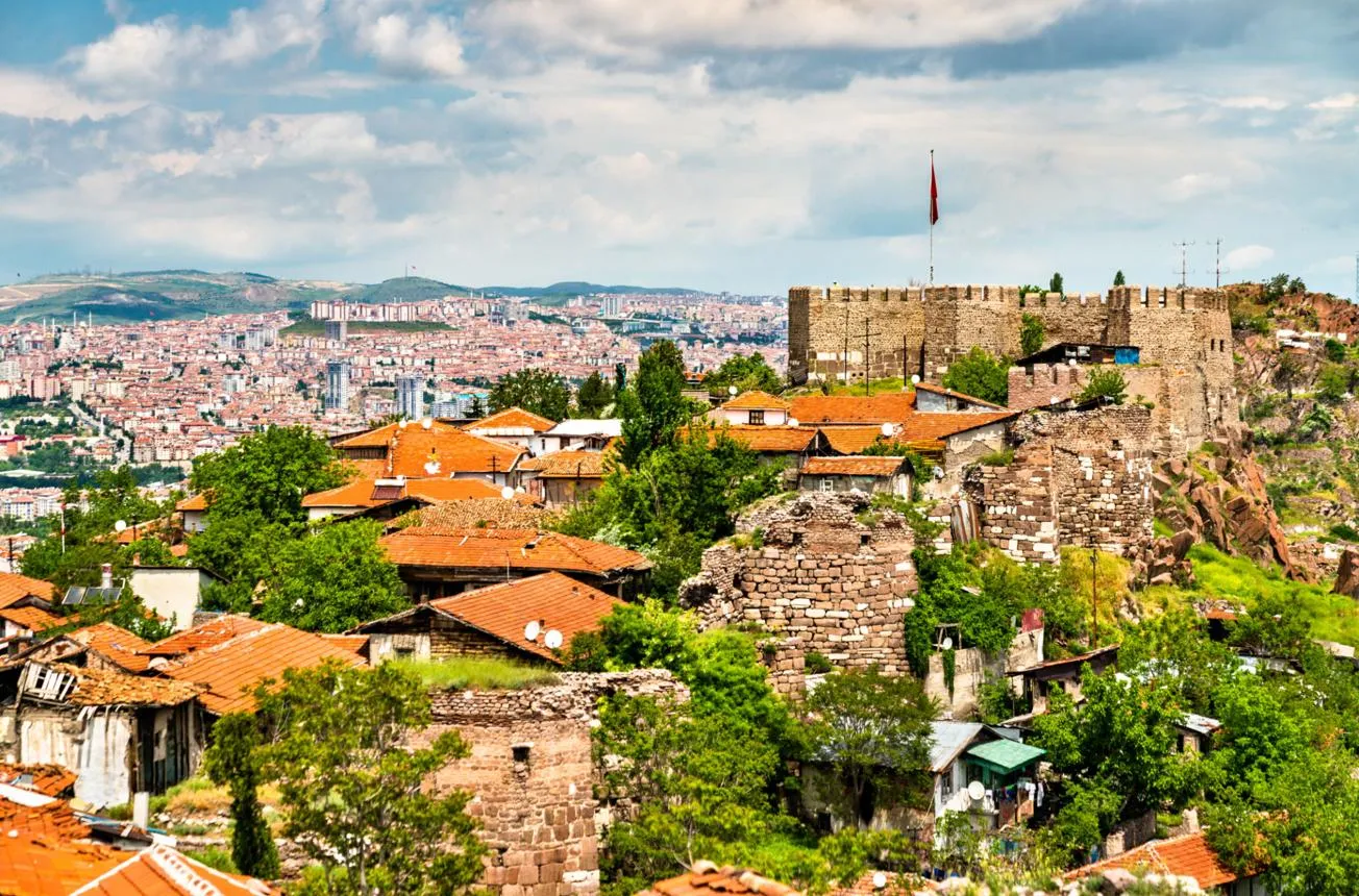 The walls of Ankara Castle above the red roofs of the old town and the modern city