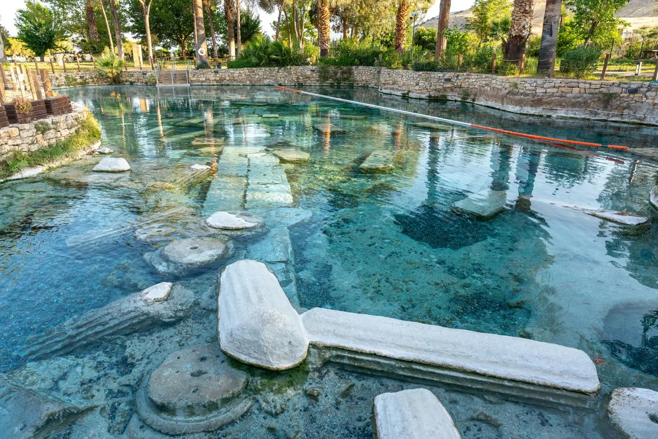 Fallen marble columns under the clear water of Cleopatra's Pool