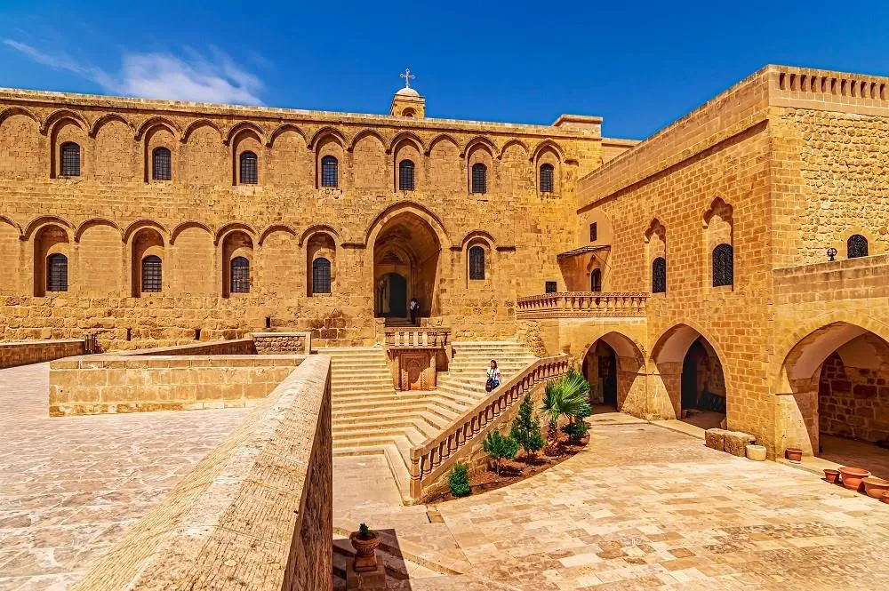 The arched façade and courtyard of Deyrulzafaran Monastery