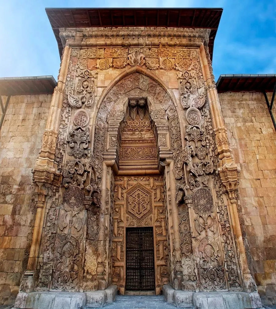 The richly carved stone portal of the Great Mosque of Divriği