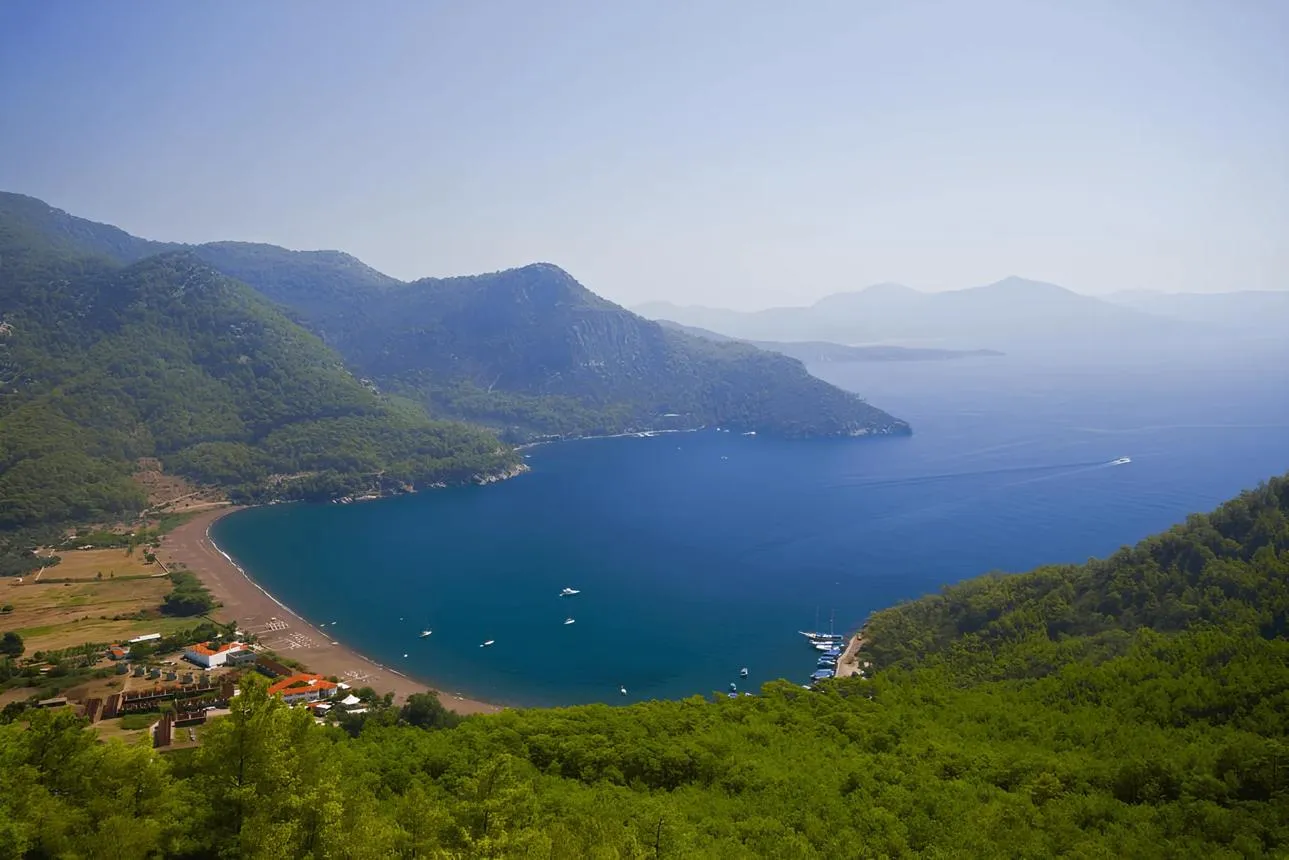 The deep blue bay of Ekincik below forested hills