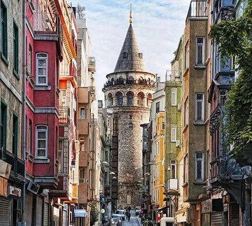 Galata Tower at the end of a narrow street of old houses