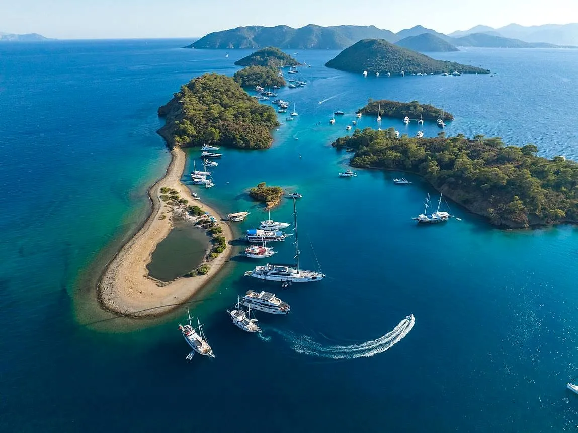 Yachts anchored around the pine-covered islands of Göcek