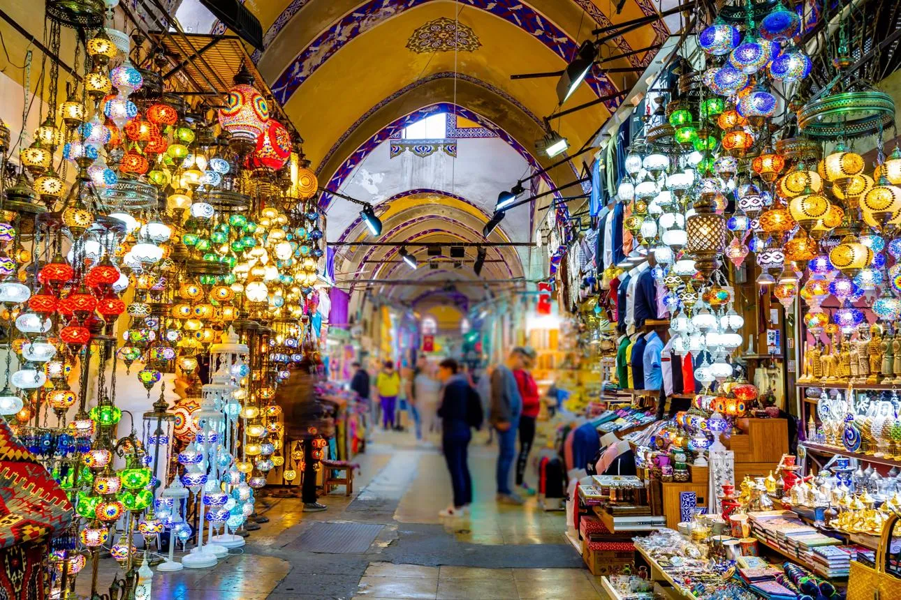 Coloured glass lamps hanging in a vaulted street of the Grand Bazaar