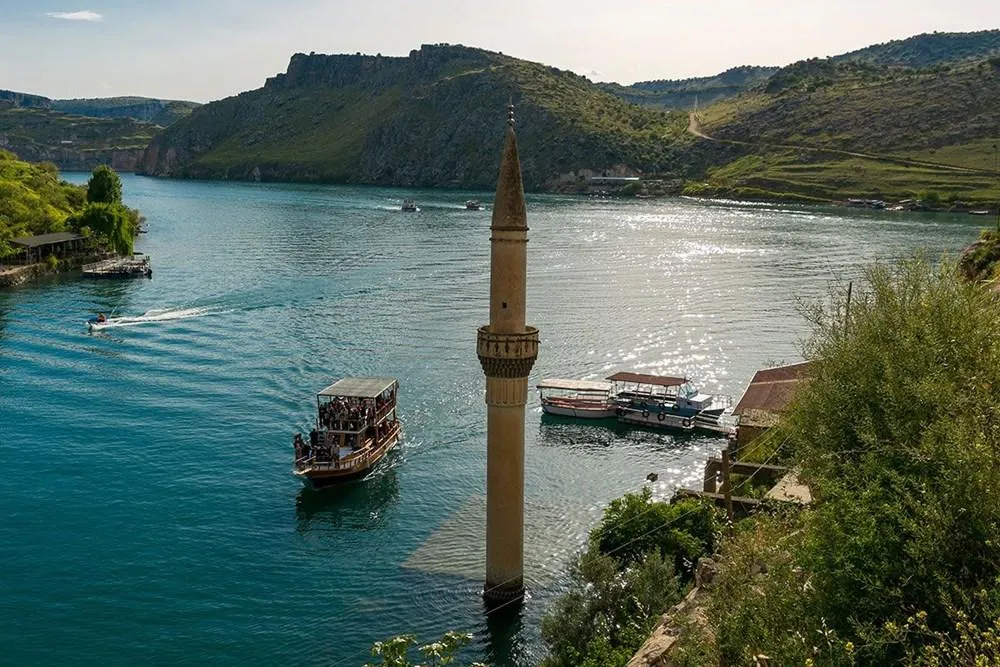 The half-submerged minaret of Halfeti and river boats on the Euphrates
