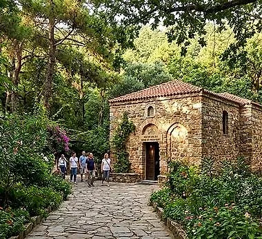 The small stone House of the Virgin Mary among trees