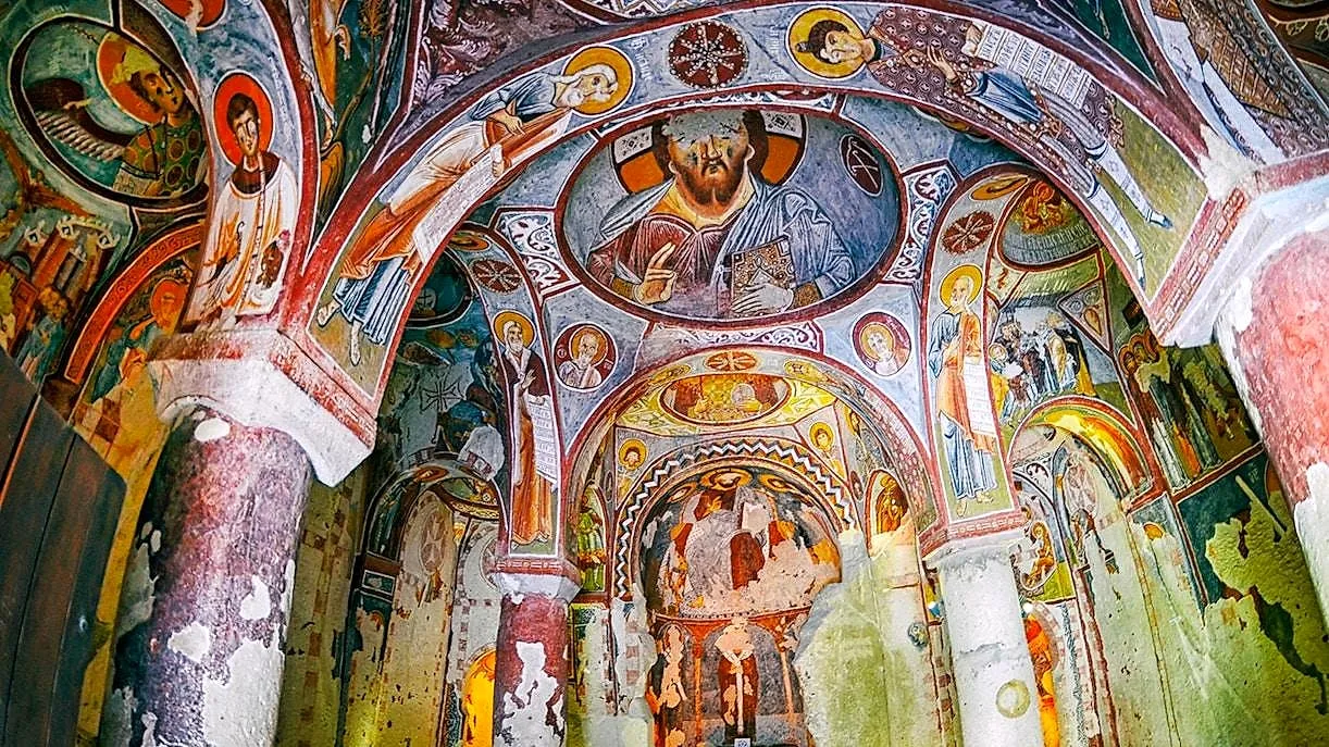 Frescoed arches inside a rock-cut church