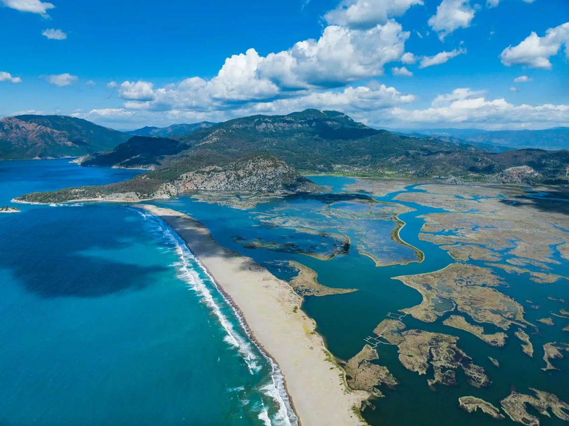 Aerial view of İztuzu Beach, the sea on one side and the delta on the other