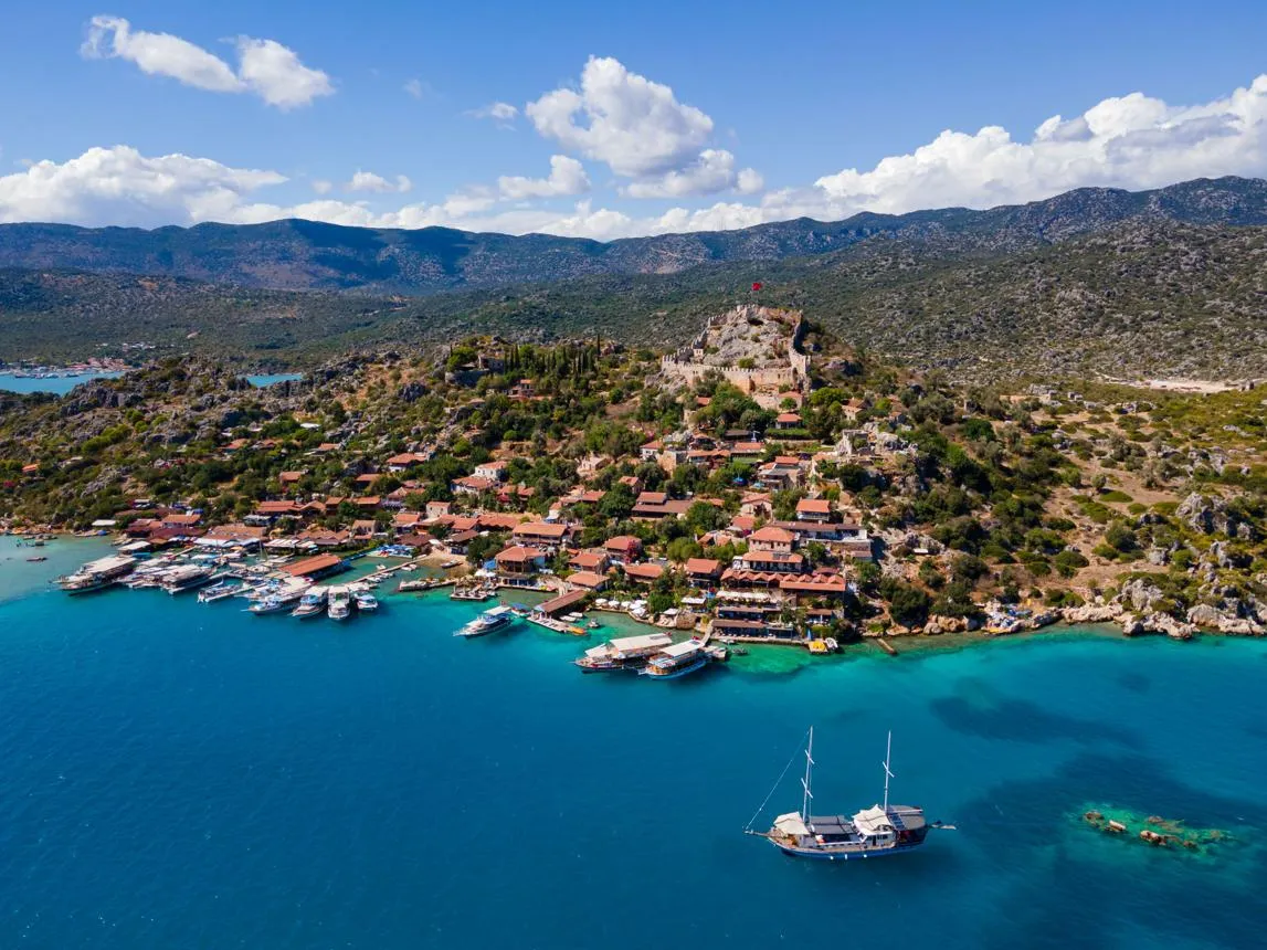 Aerial view of Kaleköy village and its castle above the bay of Kekova