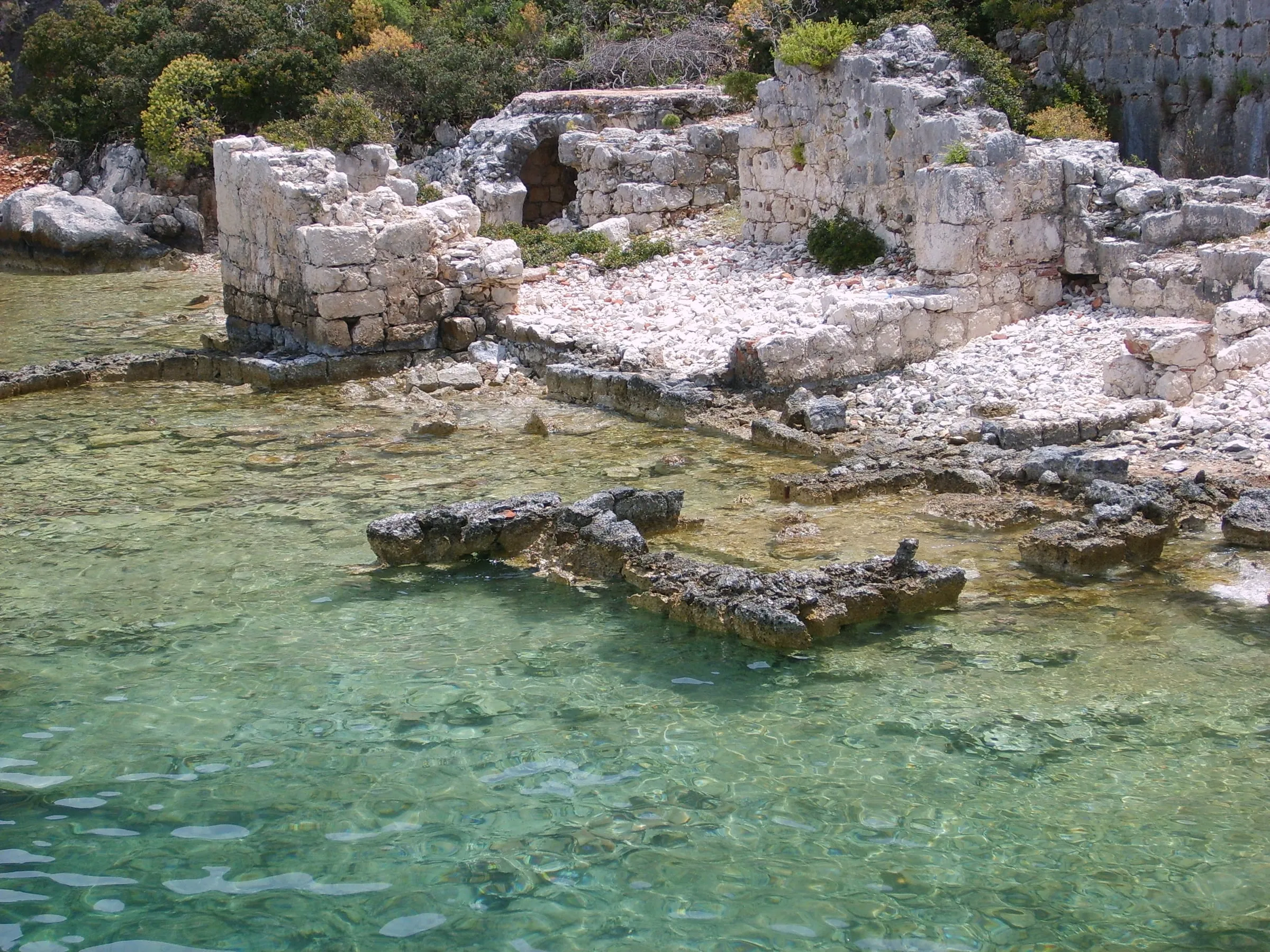Ancient ruins along the clear water of Kekova