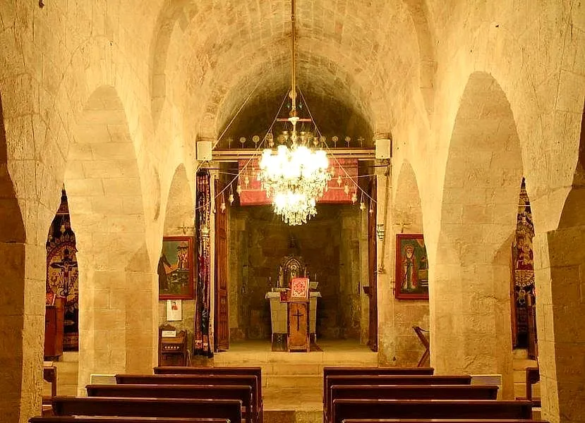 The arched nave and chandelier of Kırklar Church in Mardin