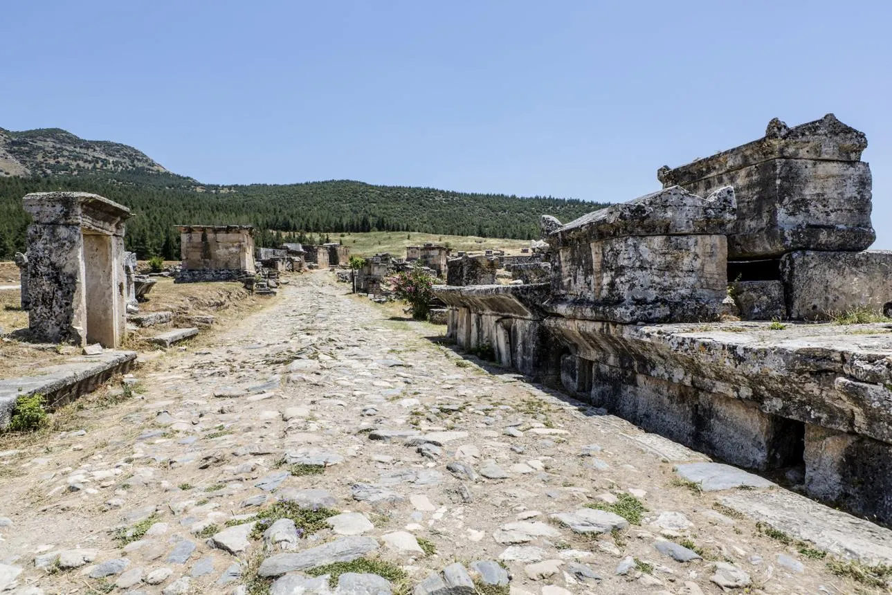 An ancient road lined with stone tombs and sarcophagi in the Hierapolis necropolis