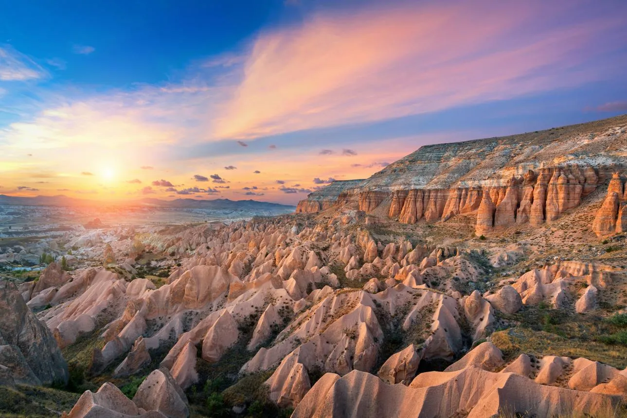 Red and pink rock formations of Red Valley at sunset