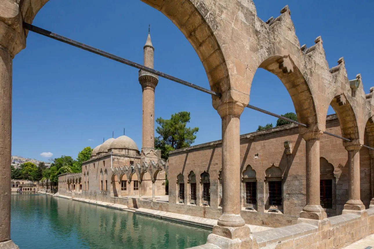 Arches framing the Halil-ur-Rahman Mosque beside the sacred pool of Balıklıgöl