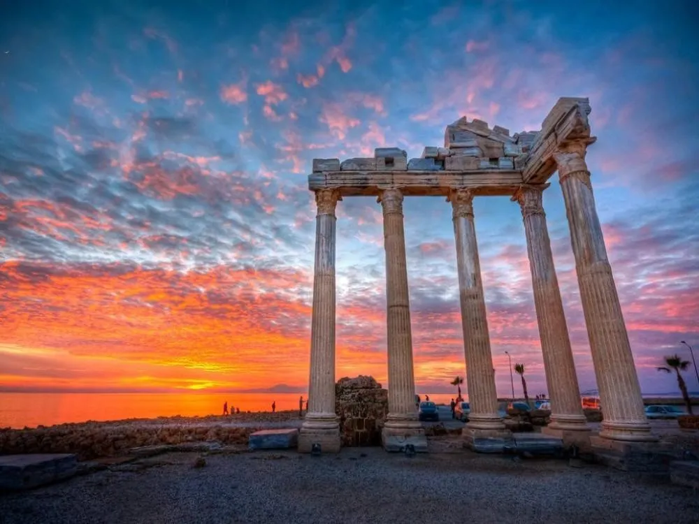 The columns of the Temple of Apollo at Side against a fiery sunset
