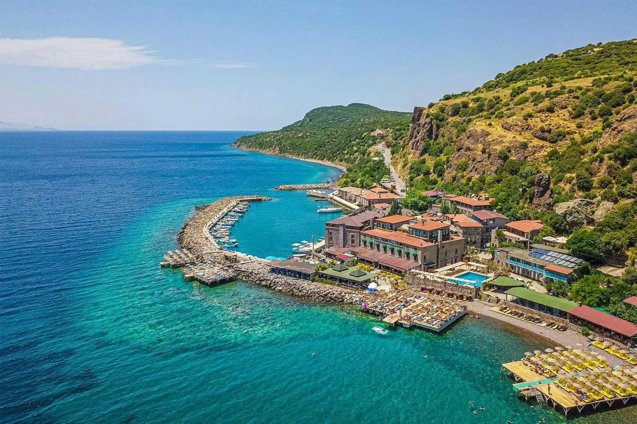 Aerial view of the small harbour and turquoise water at Sivrice
