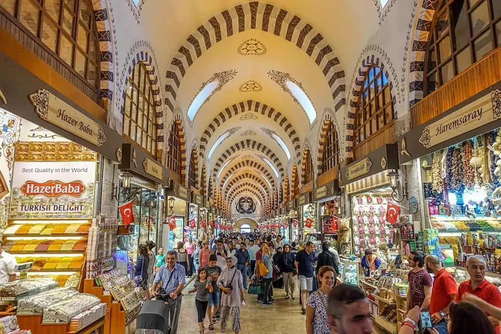 Shoppers walking under the vaulted ceiling of the Spice Bazaar