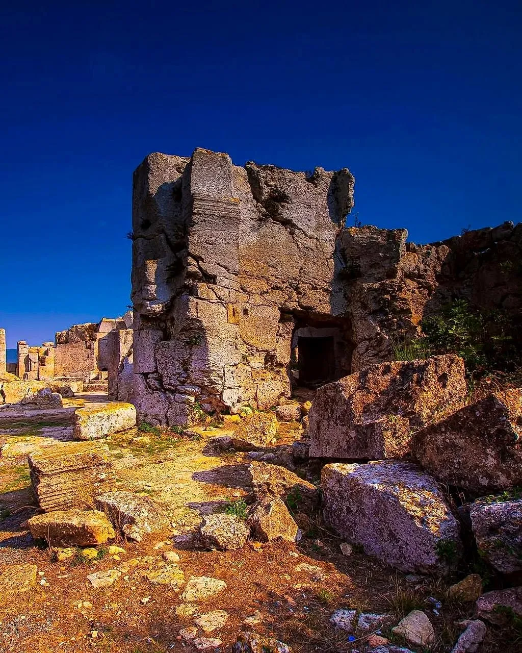 Ruined stone walls of the Monastery of St Simeon on the hills above Samandağ