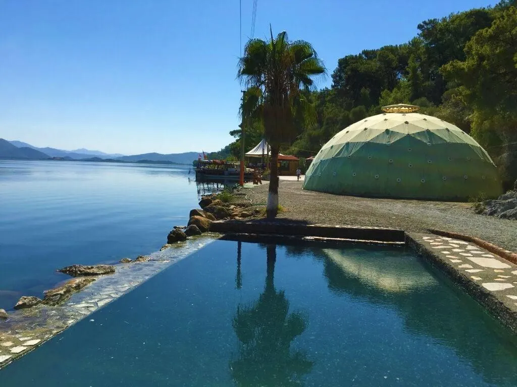 A thermal pool and domed bathhouse beside Lake Köyceğiz at Sultaniye