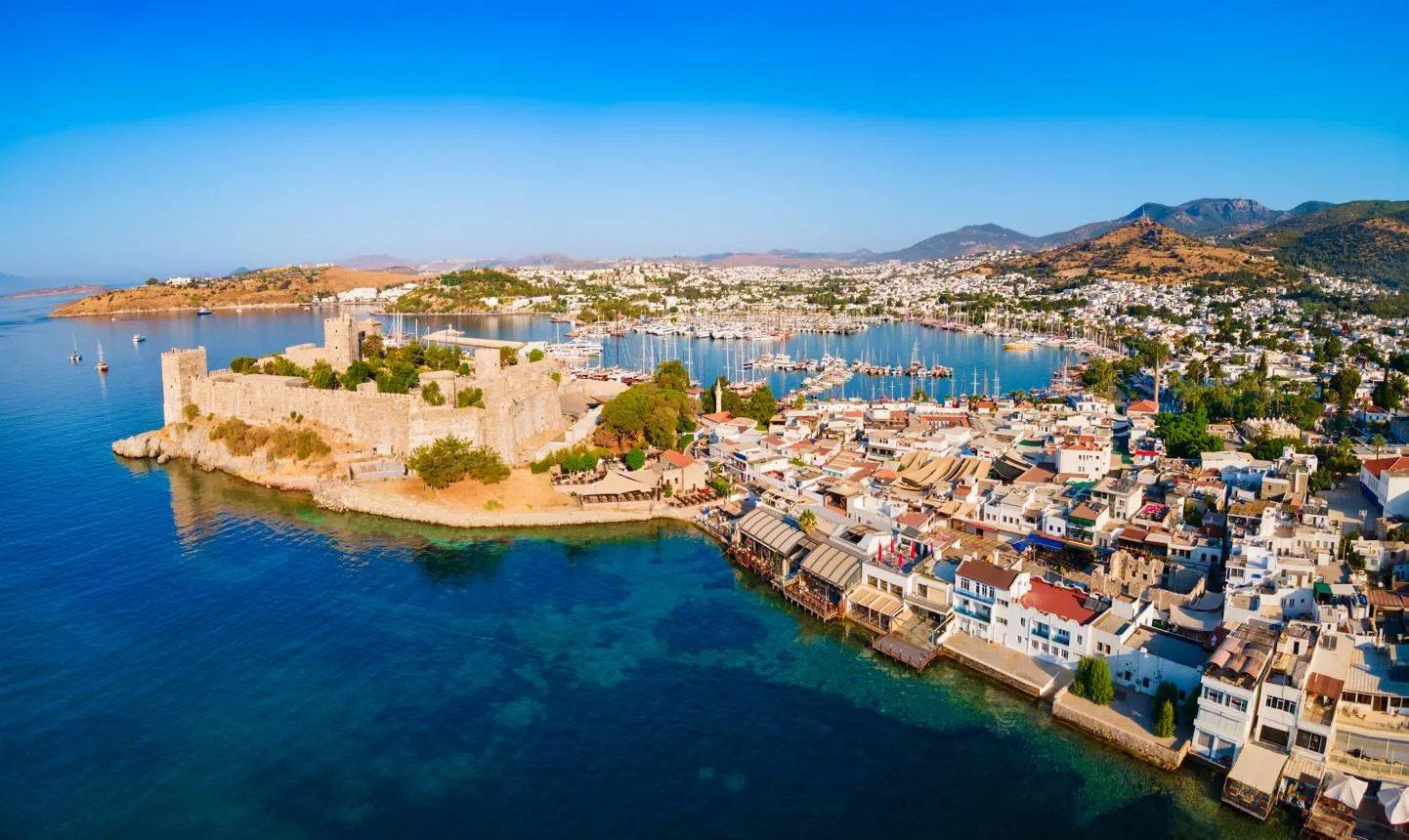 Bodrum's waterfront, the castle and the marina full of sailing boats from above