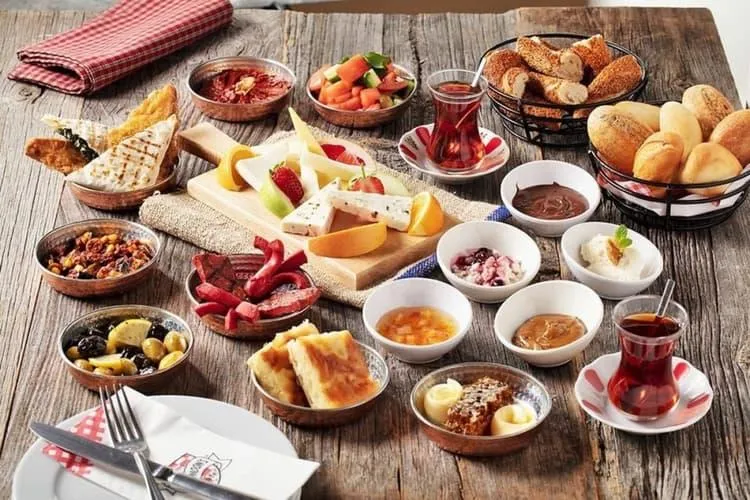 A traditional Turkish breakfast spread with tea glasses
