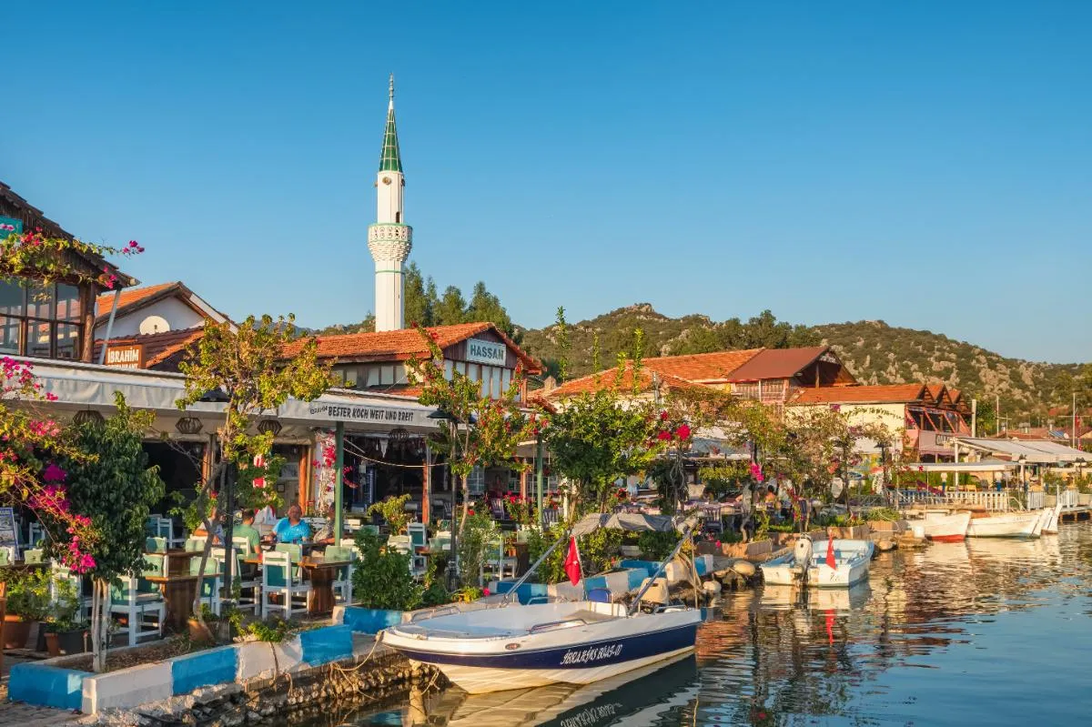 Waterfront restaurants, boats and the mosque of Üçağız village