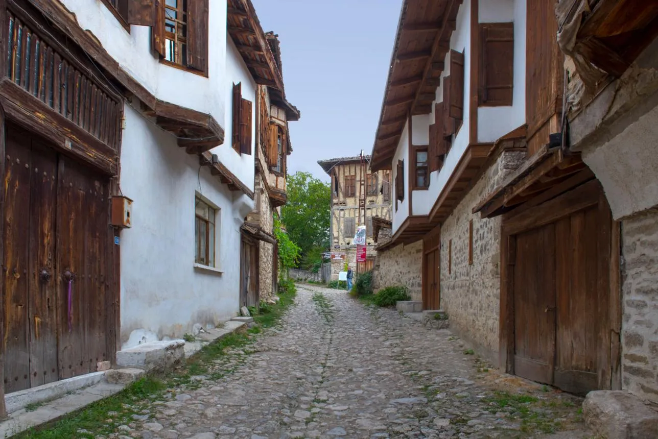 A cobbled street between old white Ottoman houses in Yörük Village