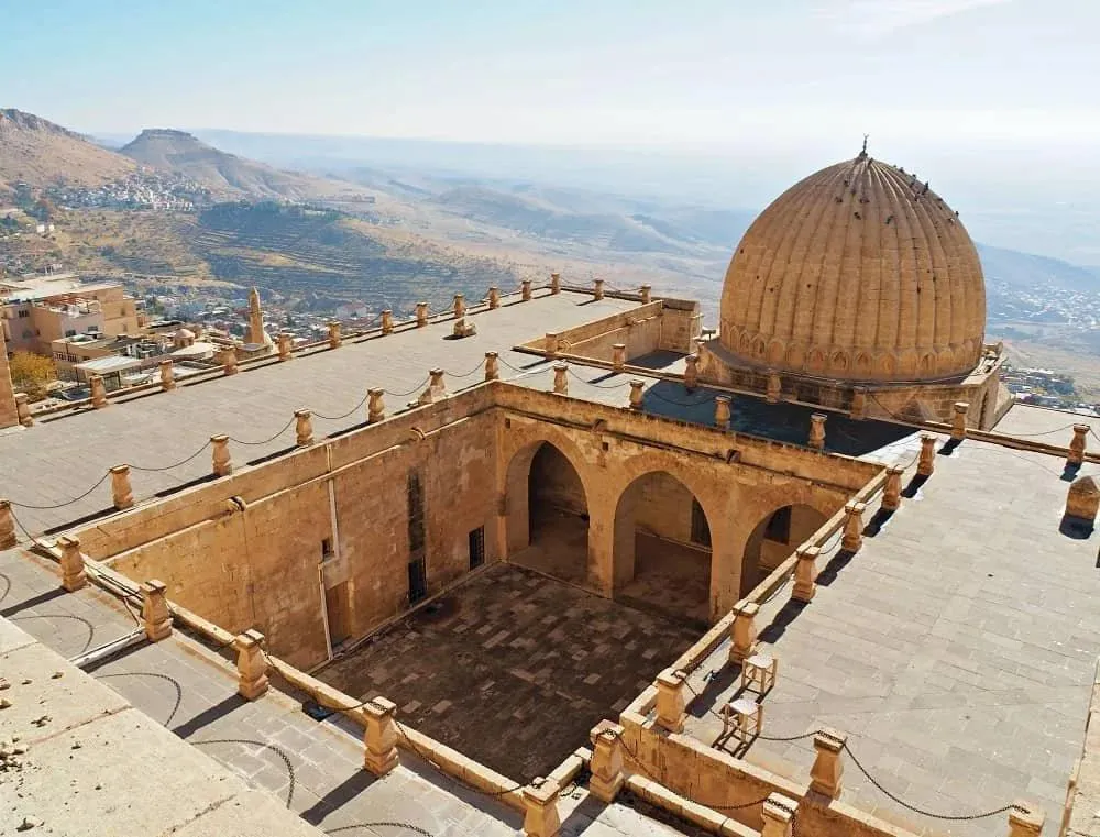 The ribbed dome and courtyard of the Zinciriye Madrasa above the city